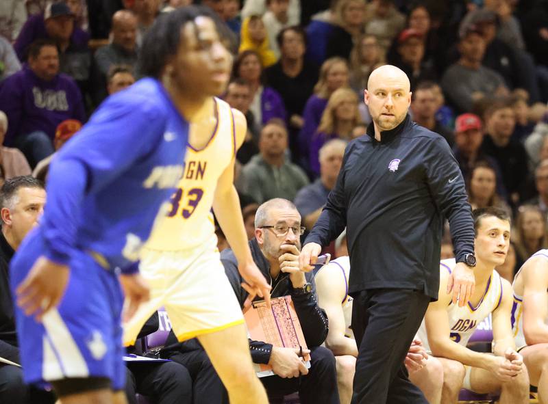 DGN coach James Thomas watches the action during the boys 4A varsity regional final between Downers Grove North and Proviso East in Downers Groves on Friday, Feb. 24, 2023.