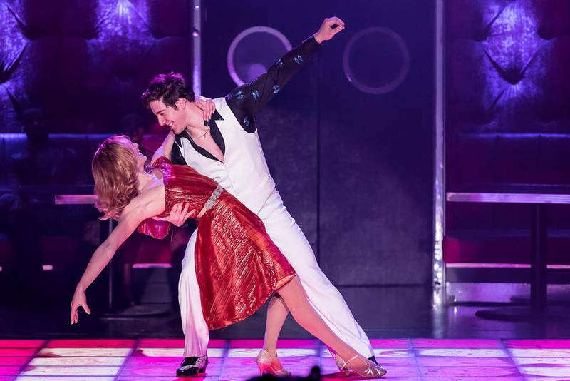 Erica Stephan and Adrian Aguilar practice their dance moves in this scene from “Saturday Night Fever” at Drury Lane Theatre. Photo by Brett Beiner