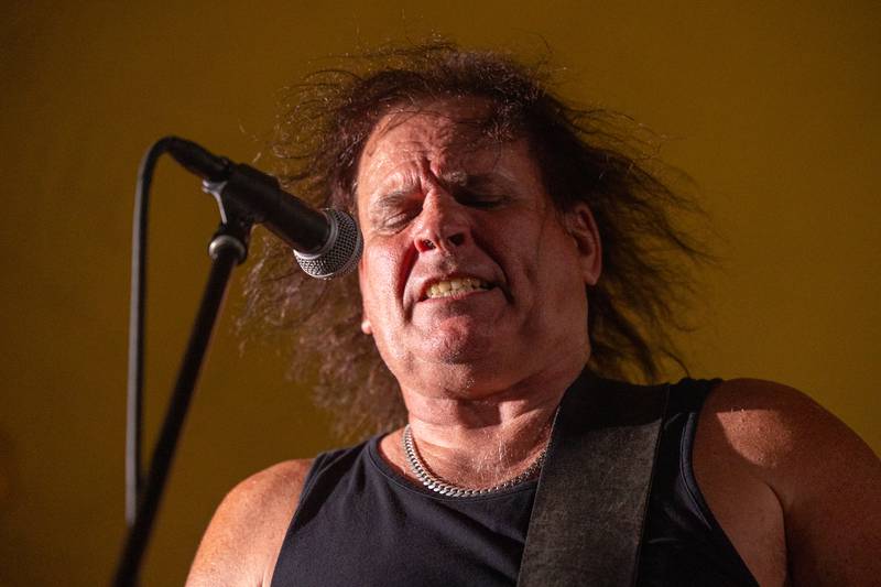 Kevin Feller of Thunderstruck sings into the microphone during a performance at the annual Cops for Cancer event on Friday, July 26, 2025, at Cerri Memorial Park in Cedar Point.