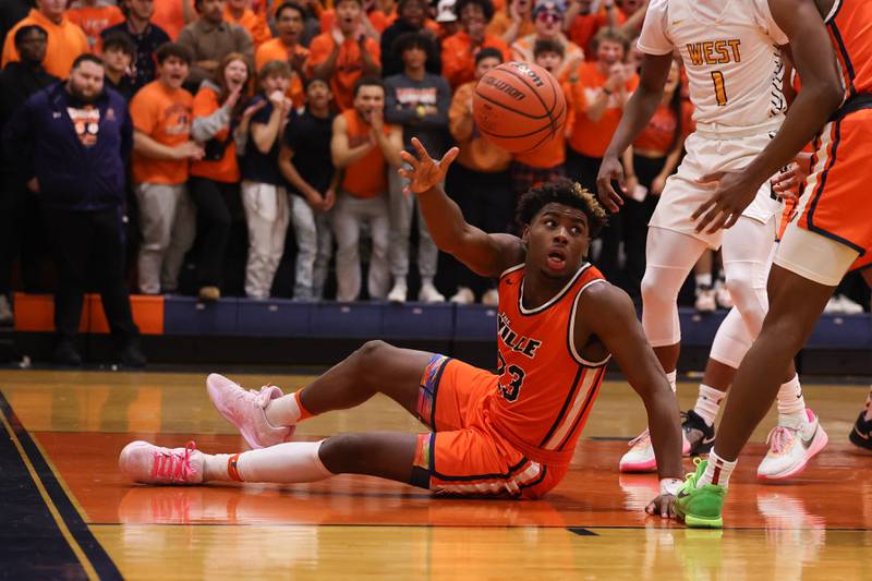 Romeoville’s Denote Cunningham passes off the loose ball against Joliet West on Tuesday January 31st, 2023.