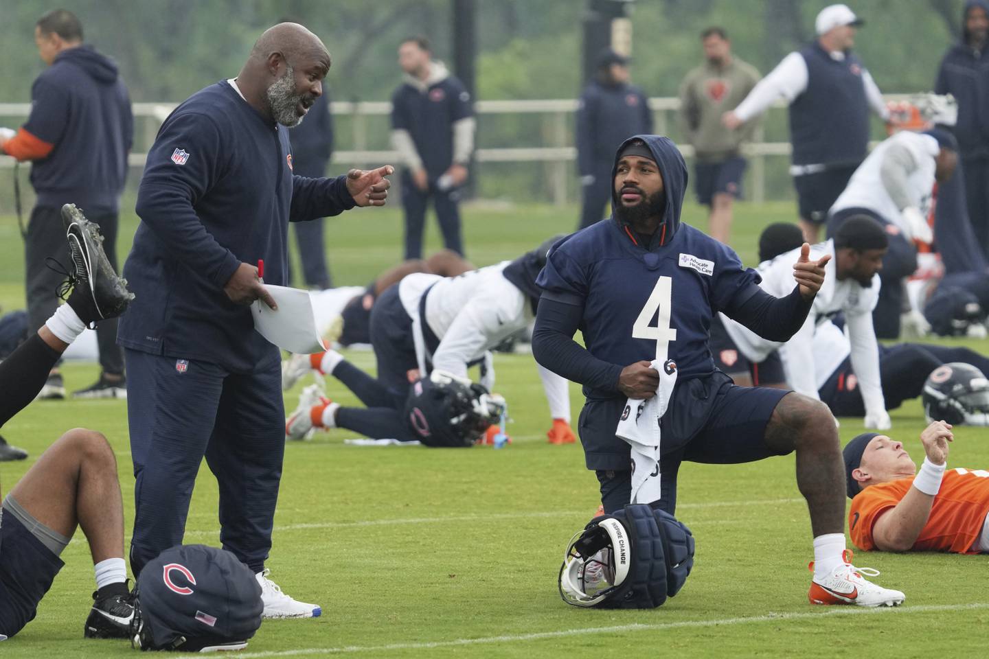Chicago Bears running backs coach Eric Bieniemy, left, talks with running back D'Andre Swift during NFL football practice at Halas Hall in Lake Forest, Ill., Wednesday, June 4, 2025. (AP Photo/Nam Y. Huh)