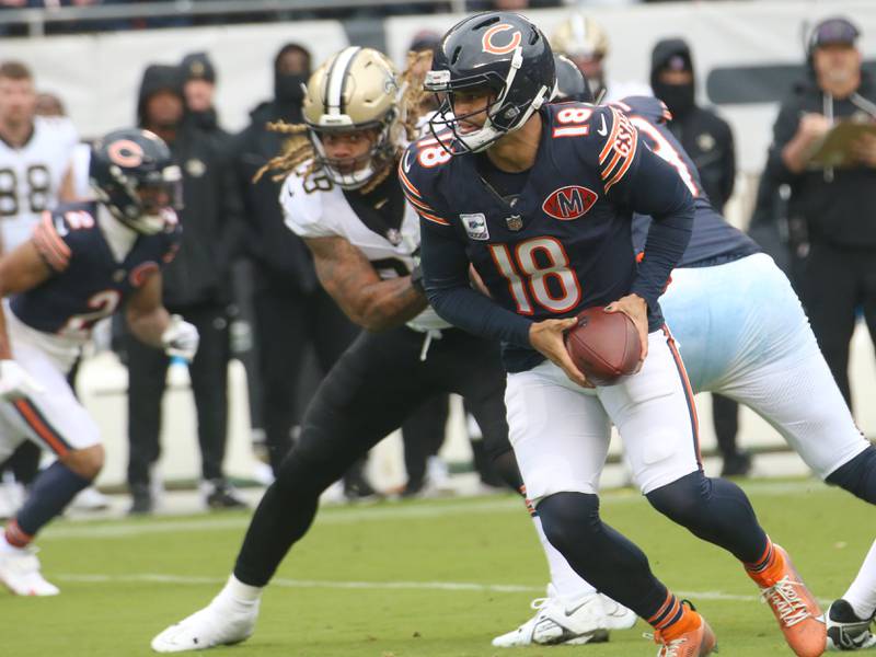 Chicago Bears quarterback Caleb Williams looks to hand off the ball on Sunday, Oct .11, 2025 at Soldier Field in Chicago.