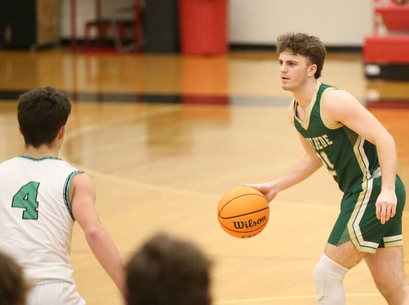 St. Bede's Gus Burr looks to pass the ball around Eureka's Cohen Alstat during the 50th annual Colmone Classic on Monday, Dec. 9, 2024 at Hall High School.