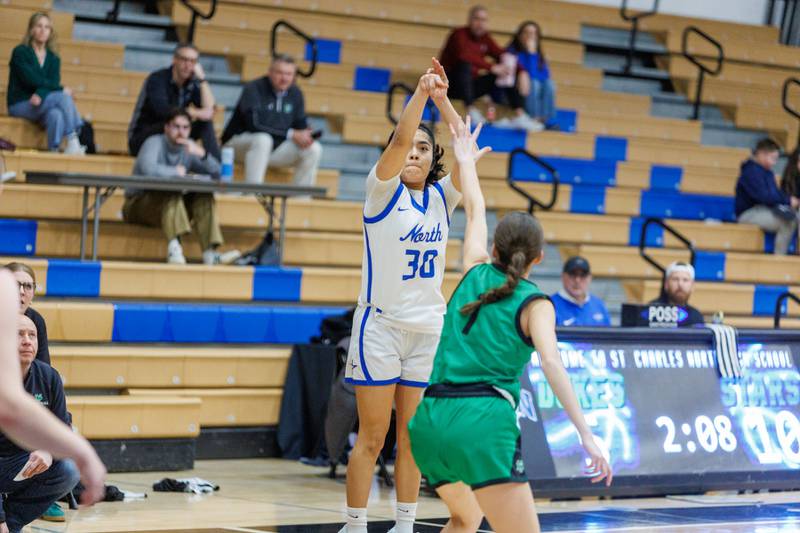 St. Charles North's Lelanie Posada shoots a three pointer against York at the Class 4A Regional Final on Thursday, Feb.19,2026 in St. Charles.