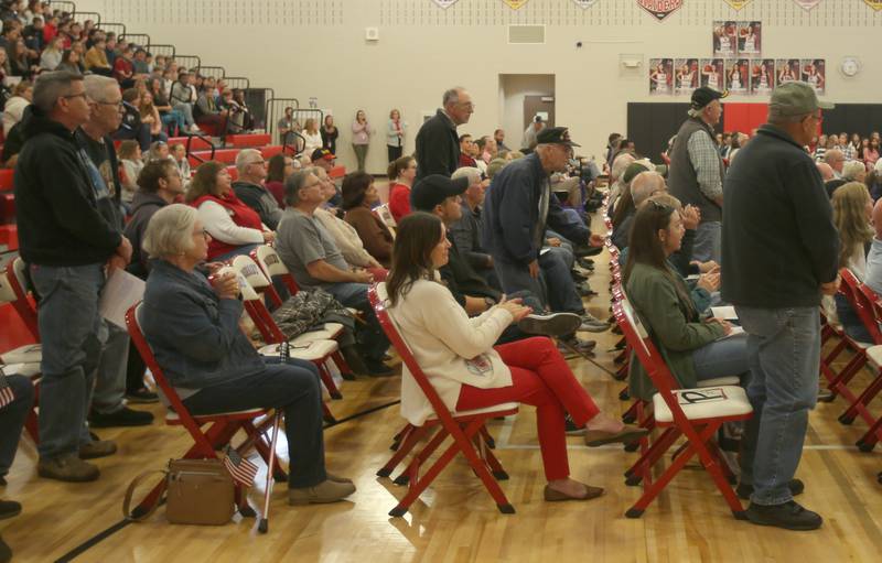 Veterans stand to be recognized during the annual Veterans Day Program on Monday, Nov. 11, 2024 at Parkside Middle School in Peru.