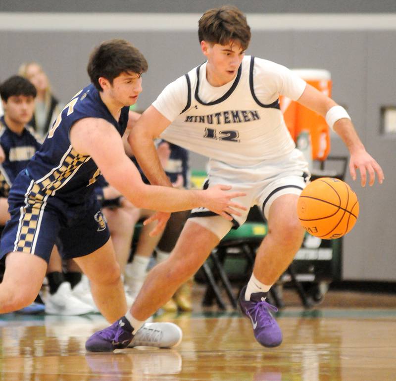 Marquette's Alex Novotney defends Lexington's Bo Stutzman (12) in the Shipyard Showdown semifinals on Friday, Dec. 26, 2025 in Seneca.