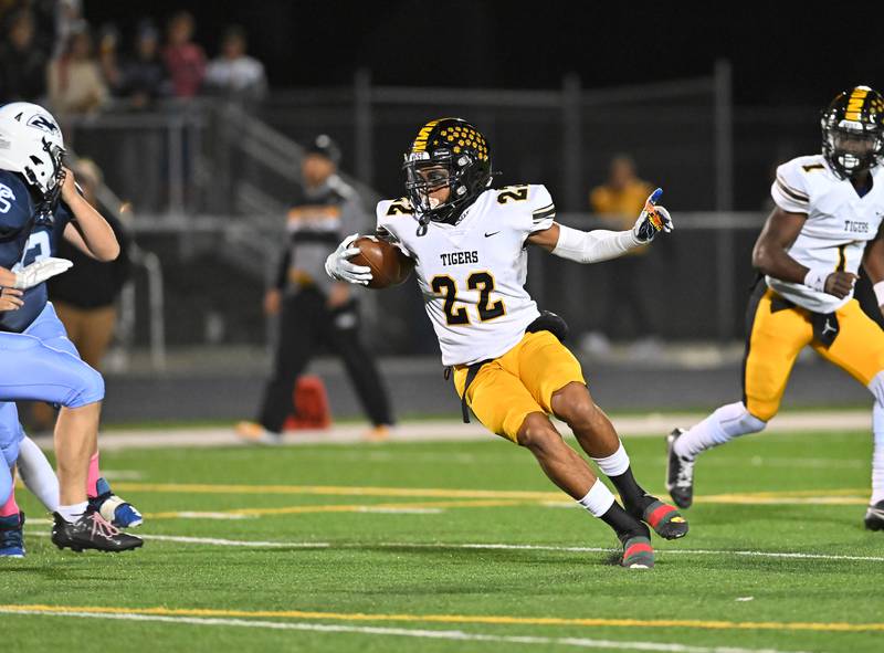 Joliet West's LaDainian Tucker (22) tries to make a big run against Plainfield South on Friday, Oct. 21, 2022, at Plainfield. (Dean Reid for Shaw Media)