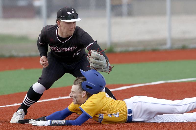 Marengo's Ryan Heuser tags out Johnsburg's Riley Johnson as he tries to steal third base during a Kishwaukee River Conference baseball game on Monday, April 21, 2025, at Johnsburg High School.