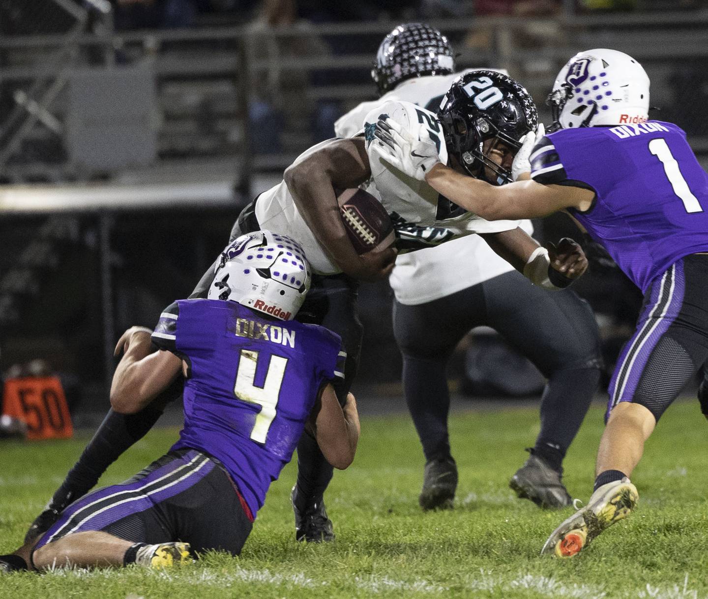 Woodstock North’s David Randecker fights for yardage against Dixon Friday, Oct. 31, 2025, in the Class 4A football first round playoffs.