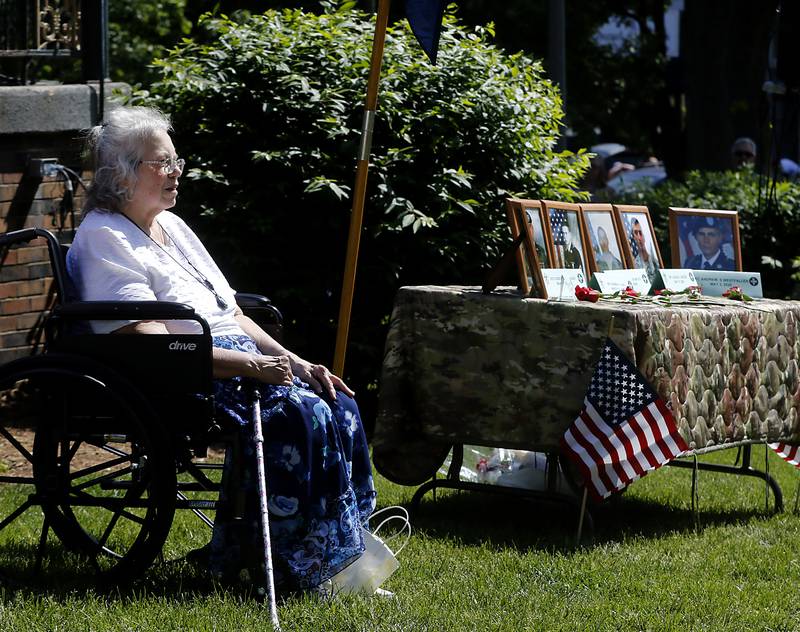 Chris Gehrke, the Grand Marshal of this year’s parade sits next the remembrance table during the Woodstock VFW Post 5040 City Square Memorial Day Ceremony and Parade on Monday, May 29, 2023, in Woodstock.