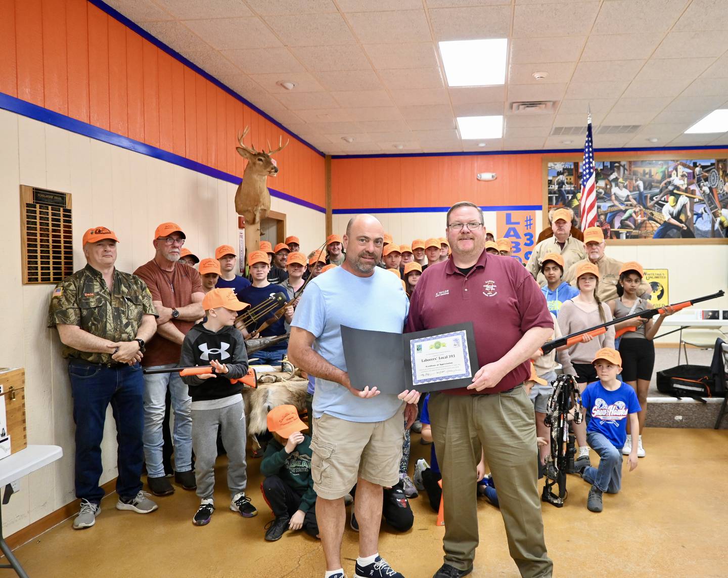 Brett Taylor, IDNR Safety Education Coordinator for Region 1 presents the certificate of 30 years to Business Manager Kevin Dale on Sunday April 14, 2024.