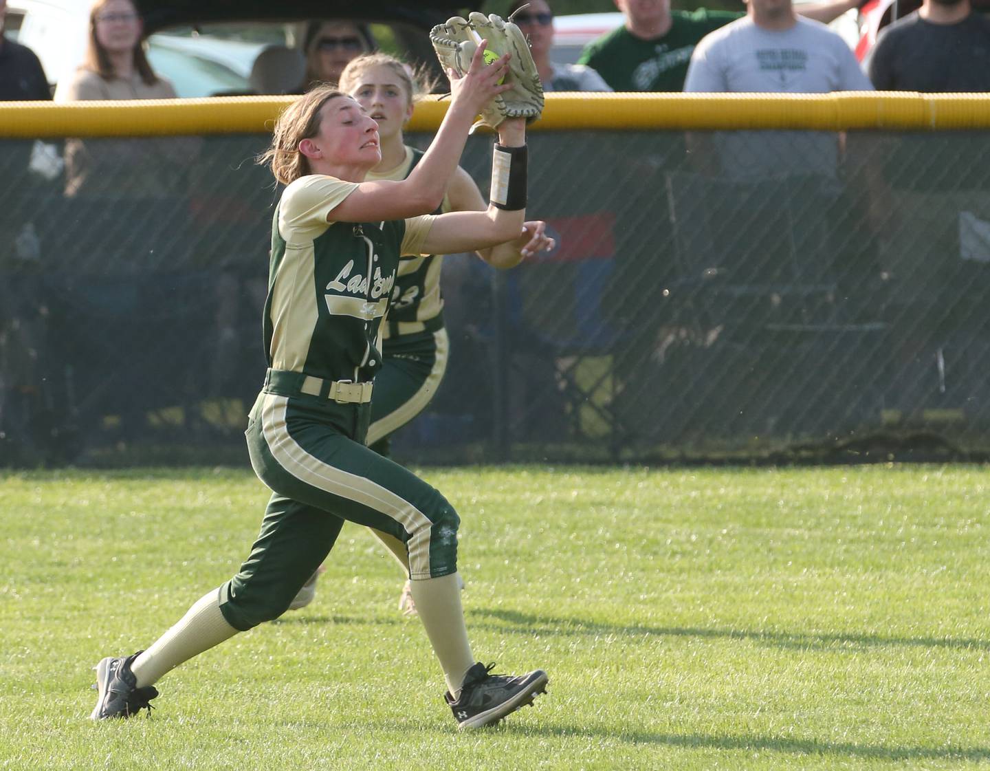 St. Bede left fielder Emma Slingsby makes a catch on the run against Ridgewood Alwood/Cambridge in the Class 1A Sectional semifinal game on Tuesday, May 23, 20223 at St. Bede Academy.