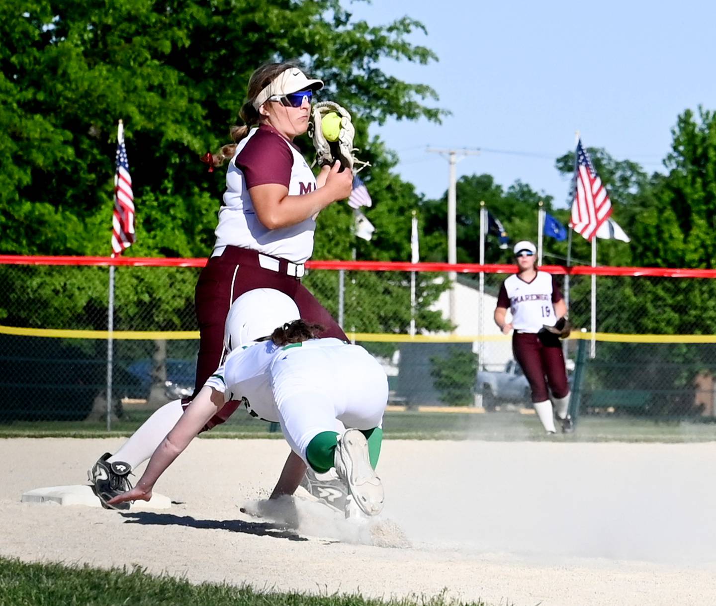 Marengo's Emily White secures the catch at third for a force out of Rock Falls runner Jeslyn Krueger during Friday's Class 2A Stillman Valley Sectional championship game.