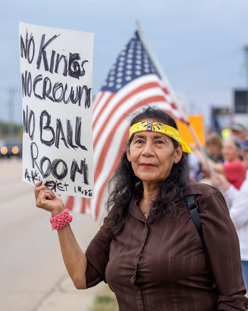 Protester holds sign at the ‘No Kings 2.0’ Protest on Saturday, October 18, 2025 on North Division Street in Morris.