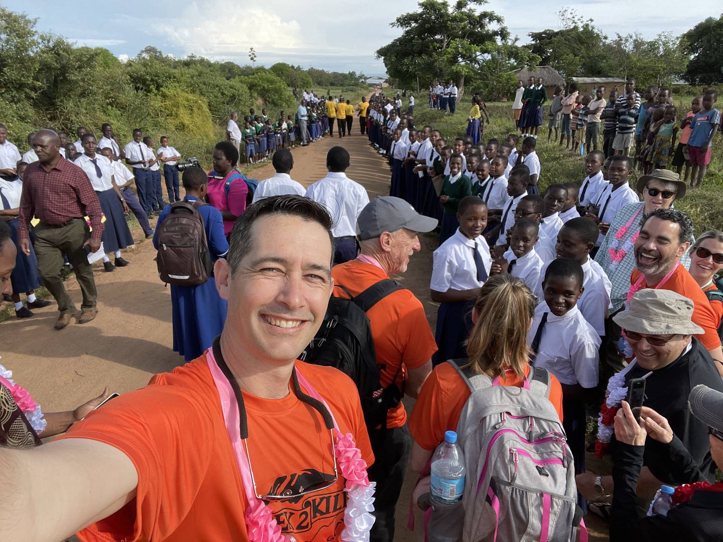 Tanzania Development Support volunteer Eric Hill is wowed by the celebration at Nyegina school in honor of the successful summiting of Mount Kilimanjaro in May 2022 and raising funds for the school.