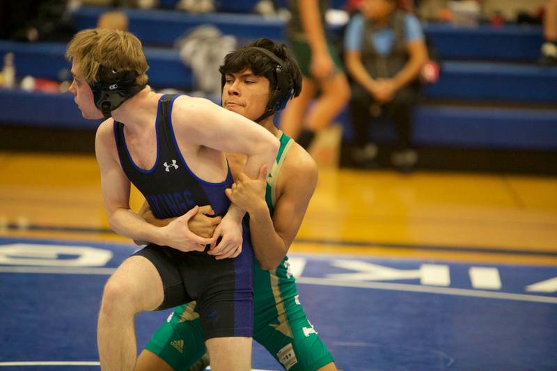 Geneva's Caleb Fleck competes with Lane Tech's Angel Santana in the 120 lb. class at the Newbill Invitational on Saturday, Jan.6,2024 in Geneva.