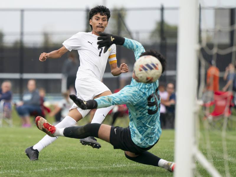 Harvard's Jesus Aquino gets a goal past Woodstock North goalkeeper Alex Carbajal during the Kishwaukee River Conference Tournament Championship game on Monday, October 6, 2025 at Woodstock North High School. Ryan Rayburn for Shaw Local