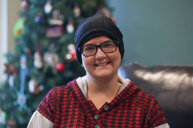 Jody Burke, a single mom who was diagnosed with a rare cancer, poses for a photo in her home in Crest Hill on Saturday, Dec.16th 2023.