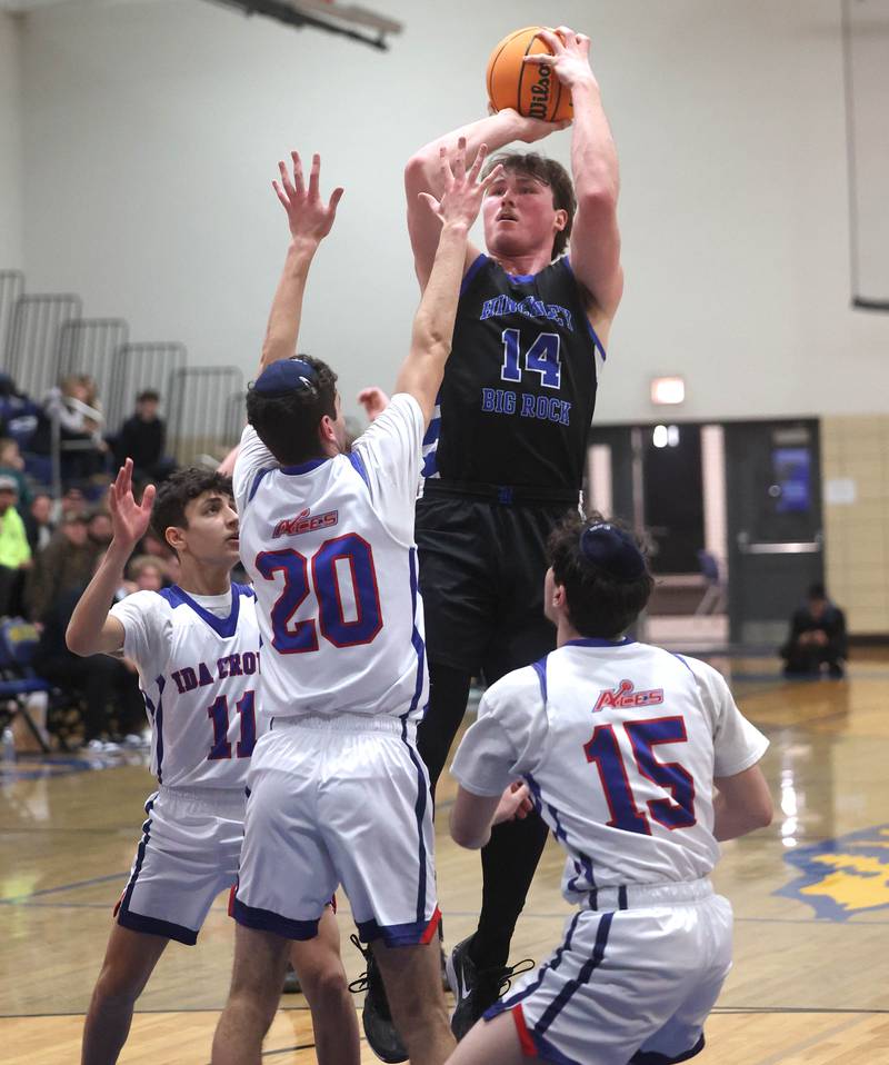 Hinckley-Big Rock's Martin Ledbetter shoots the ball between three Ida Crown defenders during their Class 1A sectional game Wednesday, March 5, 2025, at Somonauk High School.