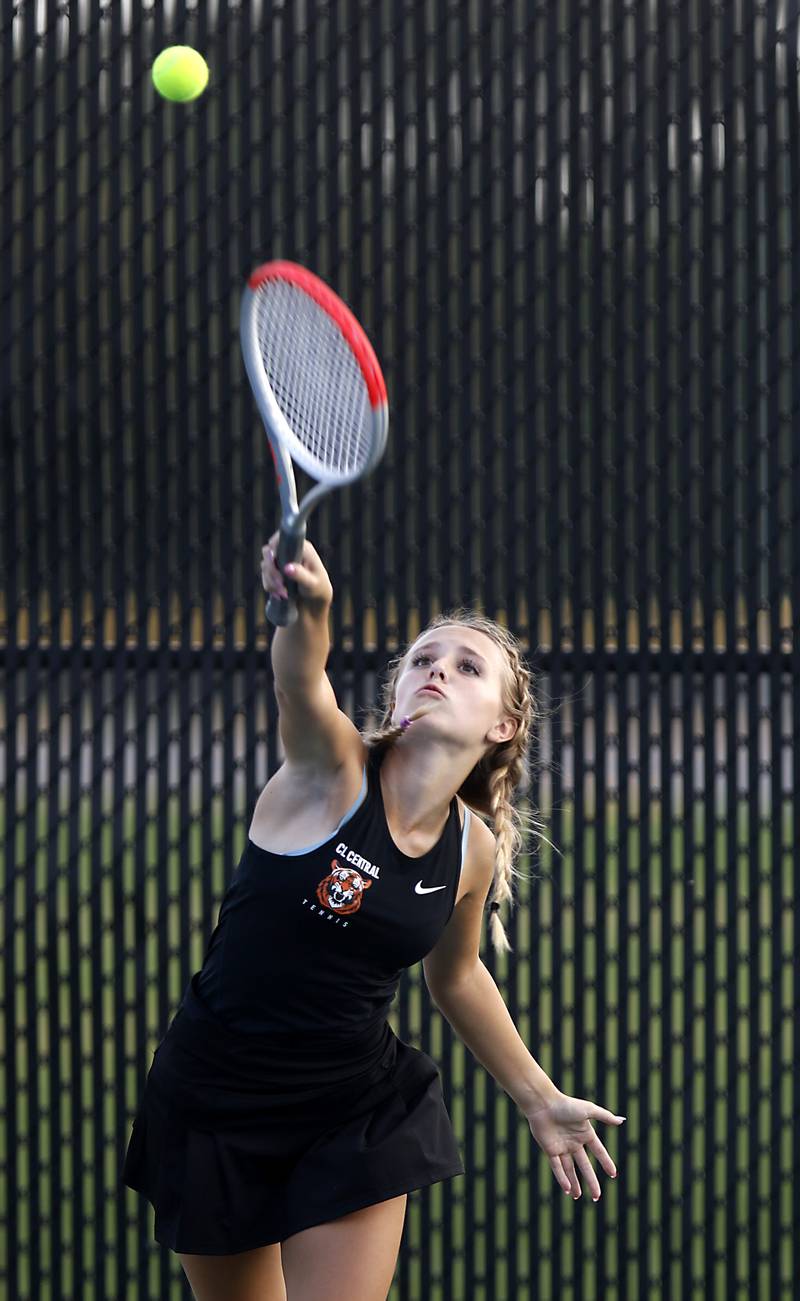 Crystal Lake Central’s Bella Lisle serves the the ball during a Fox Valley Conference tennis match on Monday, Sept. 25, 2023, at Crystal Lake Central High School.