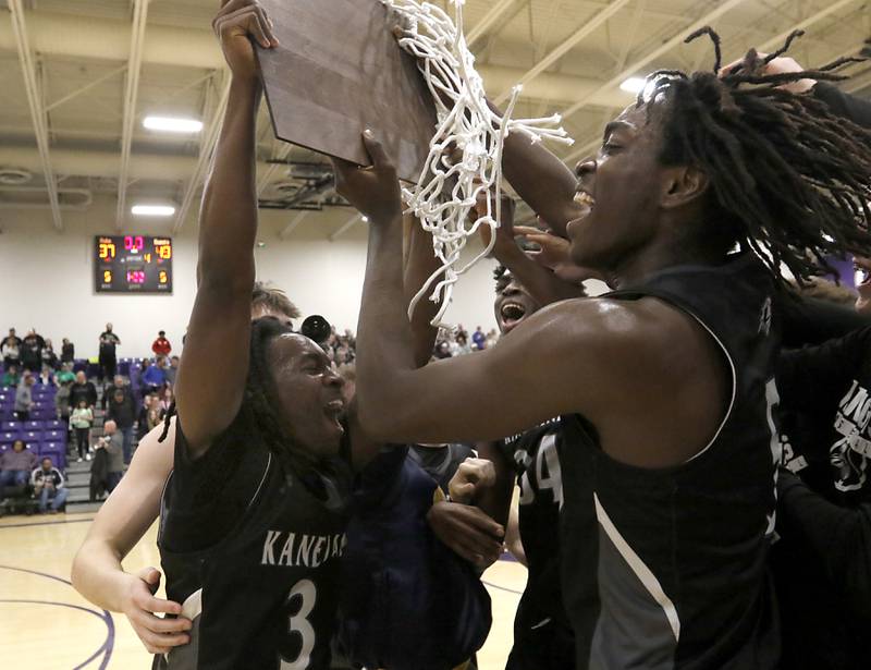 Kaneland's Marshawn Cocroft, Jeffrey Hassan and Freddy Hassan celebrate their win over Crystal Lake South in the IHSA Class 3A Rochelle Sectional championship basketball game on Friday, March 7, 2025, at Rochelle High School.