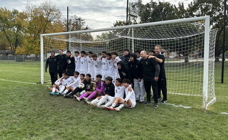 The Streamwood boys soccer team poses with a Class 2A regional plaque after winning the Crystal Lake Central regional title