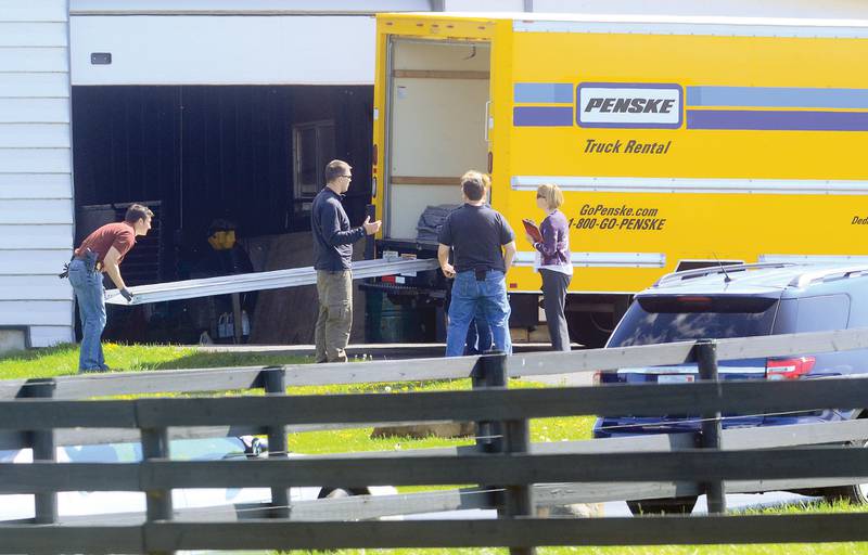 After the arrest of Crundwell, federal agents load up items seized from her Dixon home April 17, 2012.