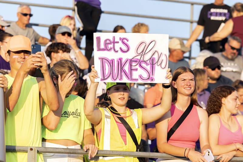 Charlie Cole of Dixon shows off a sign Friday, August 25, 2023 as Dixon takes on Stillman Valley in week one football action.