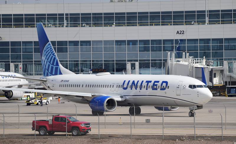 A United Airlines jetliner is pulled out of a gate at Denver International Airport Friday, May 26, 2023, in Denver. (AP Photo/David Zalubowski)