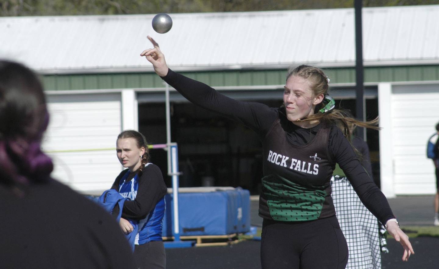 Rock Falls' Kayla Hackbarth throws the shot put at the Rock Falls Rocket Invite at Hinders Field two years ago.