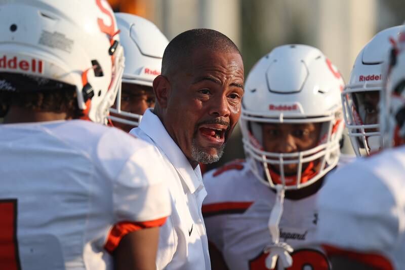 Shepard head coach John Rone talks to his offense before kick-off against Joliet West on Friday, Aug. 25, 2023 in Joliet.