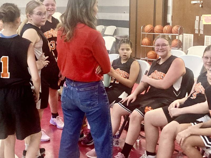 The Neponset Bobcats huddle up between quarters during Saturday's BVEC. Tournament at Princeton Christian Academy's Howard Hoffman Memorial Gymnasium.