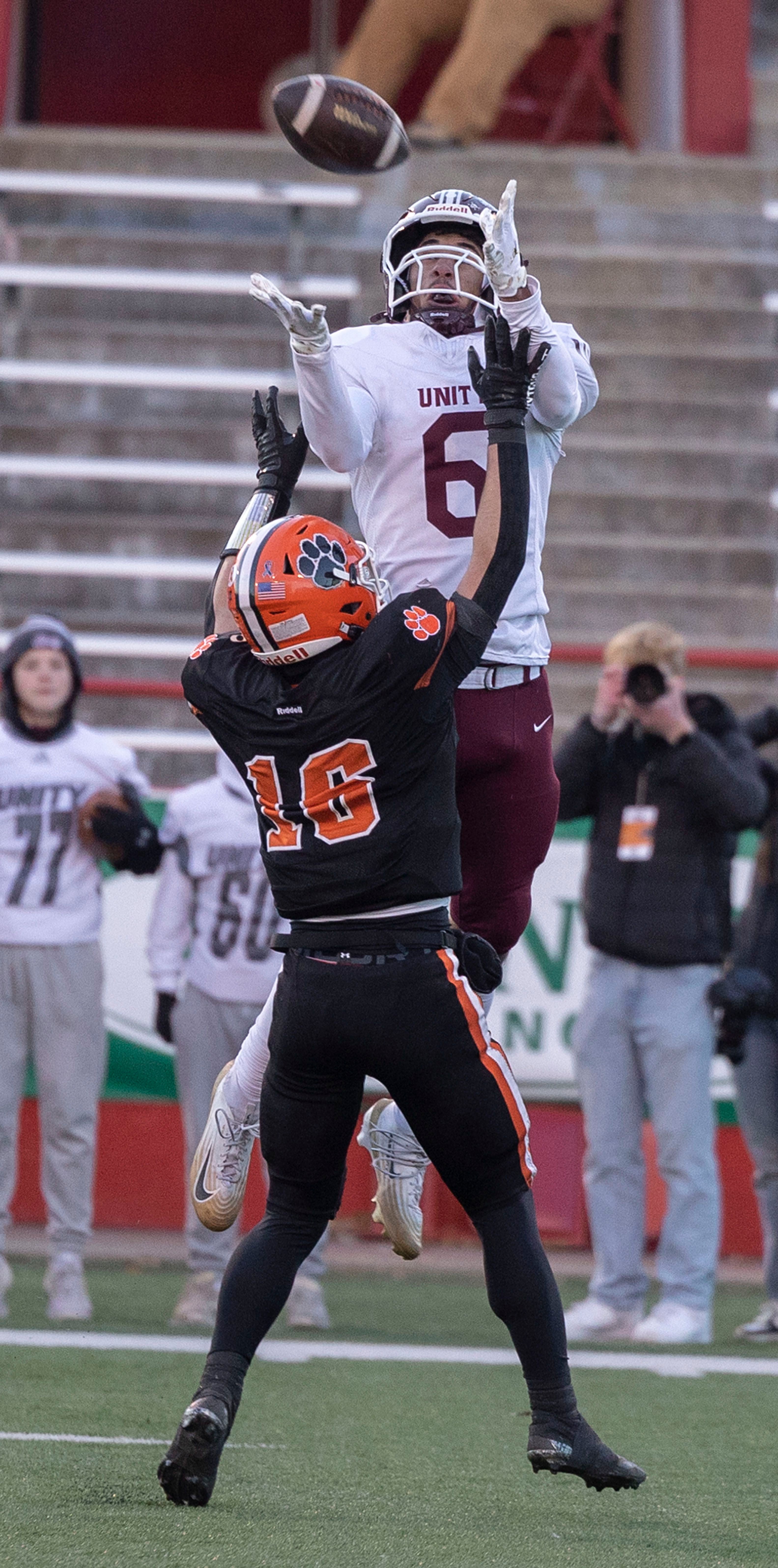 Tolono-Unity's Tre Hoggard hauls in a pass against Byron’s Andrew Talbert Friday, Nov. 28, 2025, in the Class 3A football finals at Hancock Stadium at ISU.
