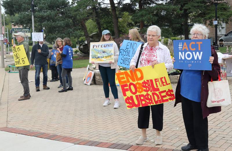 People gather for a rally Saturday, Sept. 16, 2023, at Memorial Park in downtown DeKalb. The demonstration was held to push legislators to promote alternative forms of energy and lessen the use of fossil fuels.
