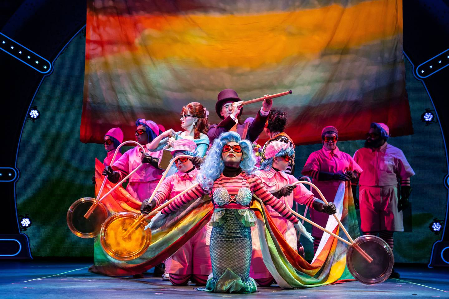 The boat ride scene in Paramount Theatre’s Professional Regional Premiere of Charlie and the Chocolate Factory, featuring Stephen Schellhardt as Willy Wonka at the helm with his telescope, and Heidi Kettenring (left) as Mrs. Teavee, with her flask. Performances are November 8, 2023-January 14, 2024. Trent Stork directs. For tickets and information, visit paramountaurora.com, or call (630) 896-6666. Photo credit: Liz Lauren