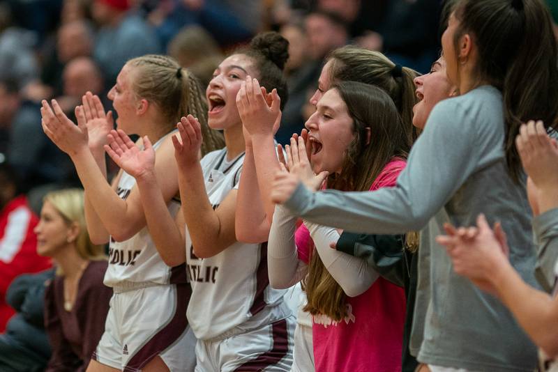 Montini celebrates their victory over Providence to win the 3A Glenbard South Sectional basketball championship at Glenbard South High School in Glen Ellyn on Thursday, Feb 23, 2023.