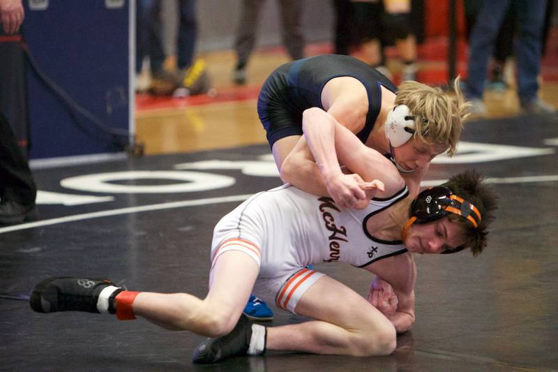 Belvidere North's Brayden Teunissen competes against McHenry's Ryan Hanson in the 106 lb Championship match at the Class 3A Sectional at Barrington High School on Saturday, Feb. 11, 2023.