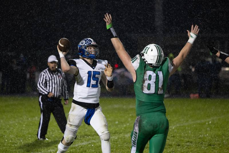 Clifton Central quarterback Brady Shule throws a pass under pressure from Dwight senior Jackson Launius during Dwight's 43-14 victory over Clifton Central in second round playoffs on Saturday, Nov. 8, 2025.