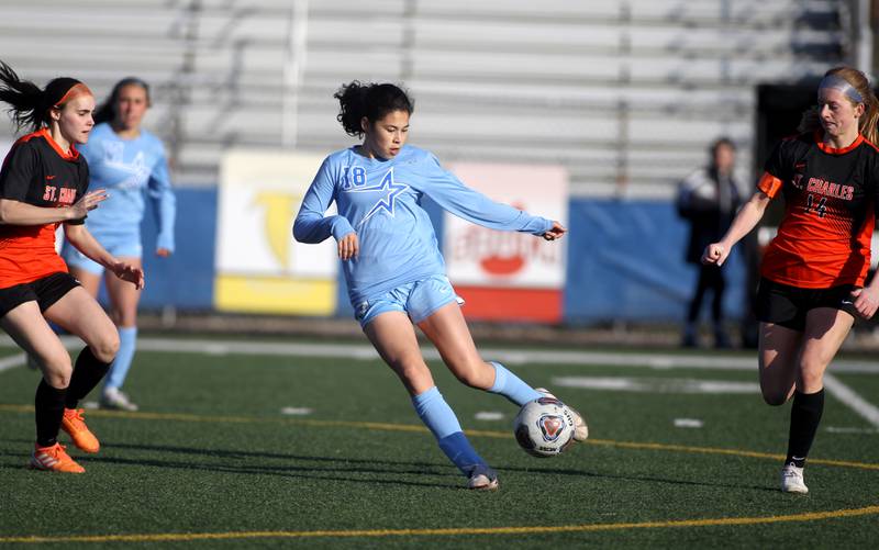 St. Charles North’s Juliana Park kicks the ball during a Tri-Cities Night game against St. Charles East at Geneva High School on Tuesday, April 26, 2022.