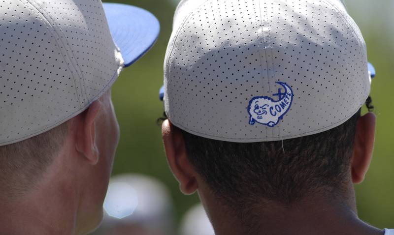 Two Newman Comet players watch the celebration following the 2A Regional baseball game at Larry Ybarra field at Newman High School, Saturday, May 18th 2024.