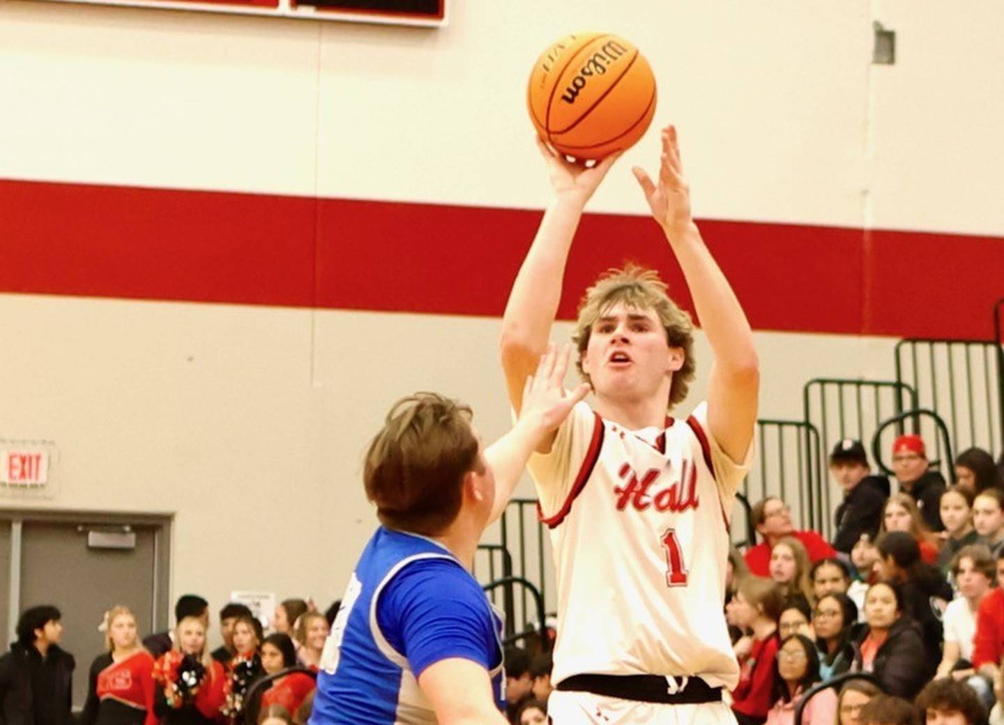 Hall's Wyatt West shoots over Princeton's Jordan Reinhardt Friday night at Hall High School. The Red Devils won 62-54.