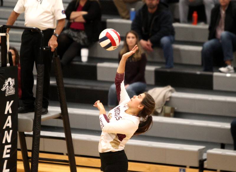 Felicity Emmerich of Morris gets the ball over the net during a game at Kaneland on Thursday, Oct. 13, 2022.