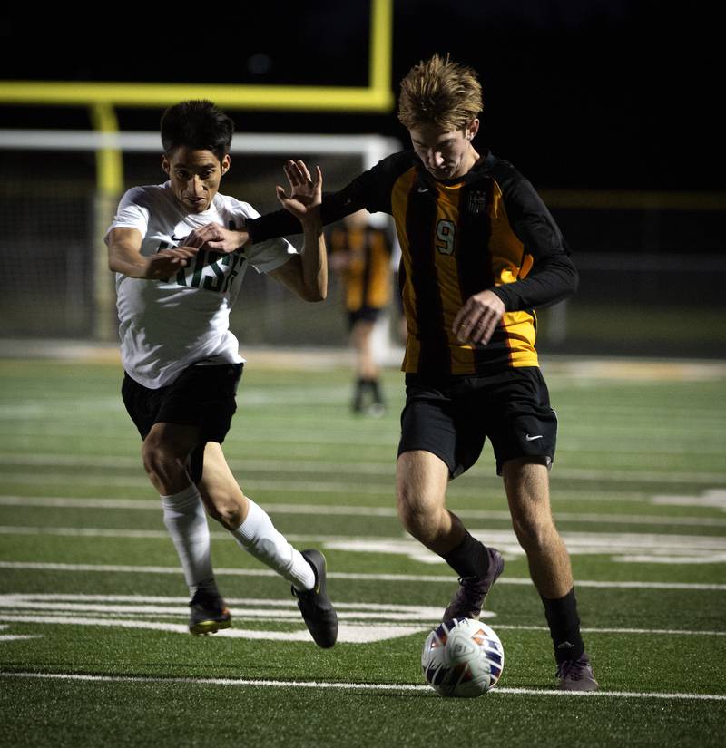 Herscher's Rowan Keigher, right, pushes forward against Bishop McNamara's Jesus Arenas, left, in a regional match-up on Tuesday, October 21, 2025.
