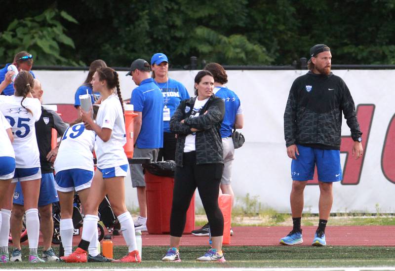 St. Charles North Head Coach Brian Harks (far right).