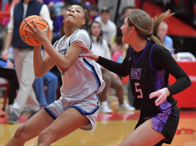 Nazareth’s Mia Gage (left) pulls up to shoot during the Class 4A Hinsdale Central Sectional final game against Downers Grove North on February 26, 2026 at Hinsdale Central High School in Hinsdale.