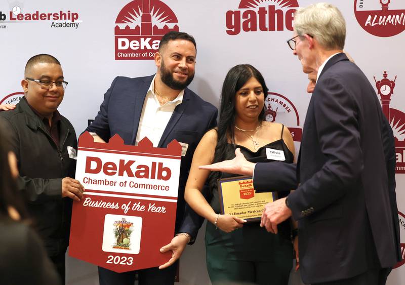 Rudy Jernadez, (left) Christopher Cardenas and Olivia Pacheco from El Jimador Mexican Grill accept congratulations from DeKalb City Manager Bill Nicklas after being named as the 2023 Business of the Year Thursday, Feb. 8, 2024, during the DeKalb Chamber of Commerce’s Annual Celebration Dinner in the Barsema Alumni and Visitors Center at Northern Illinois University.