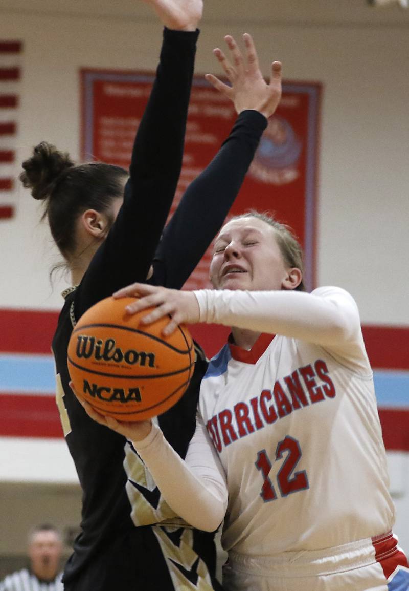 Marian Central's Abbey Miner drives to the basket agains tRockford Christian's Teagan Lawver during a nononference basketball game on Monday, Feb. 10, 2025, at Marian Central High School  in Woodstock.