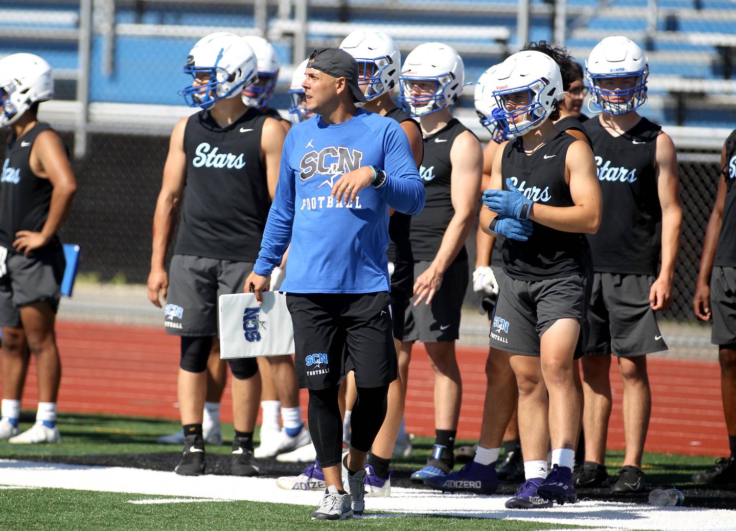 St. Charles North Head Coach Rob Pomazak walks the sideline during a 7 on 7 tournament at St. Charles North High School on Thursday, June 30, 2022.