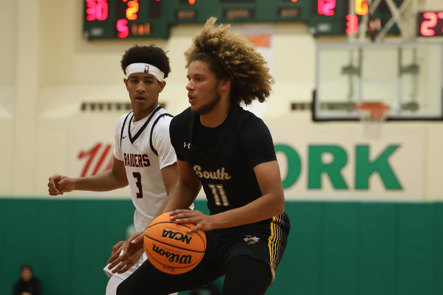 Hinsdale South’s Ayden Farrare makes a move to the basket against Bolingbrook in the 50th Annual Jack Tosh Holiday Classic on Thursday, Dec. 26, 2024 at York High School.