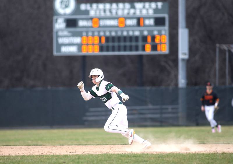 Glenbard West’s Kristian Shinohara runs to third base during a game against Batavia at Village Green Park in Glen Ellyn on Wednesday, March 13, 2024.